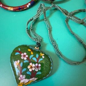 A collection of cloisonné bangle bracelet with necklace.Knotted linen with heart